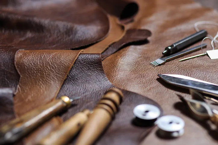 Leather's Shift from Craftsmanship to Industrial Production of animal skin to common leather and raw hide and genuine leather